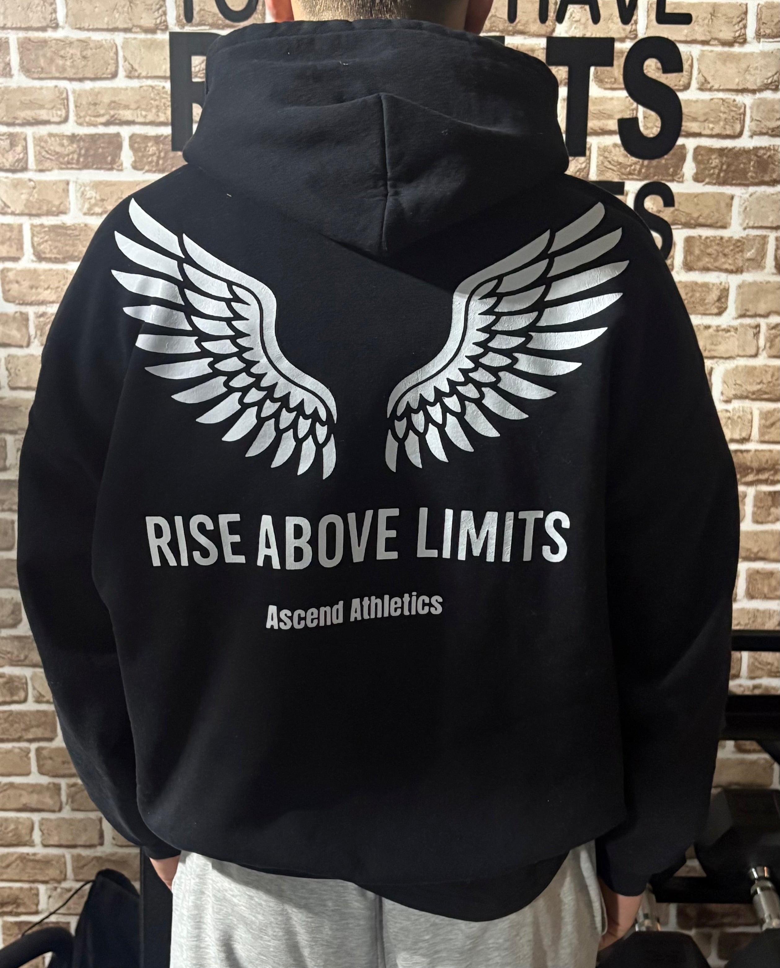 Unisex “Rise Above Limits” – Heavy Blend Hoodie
